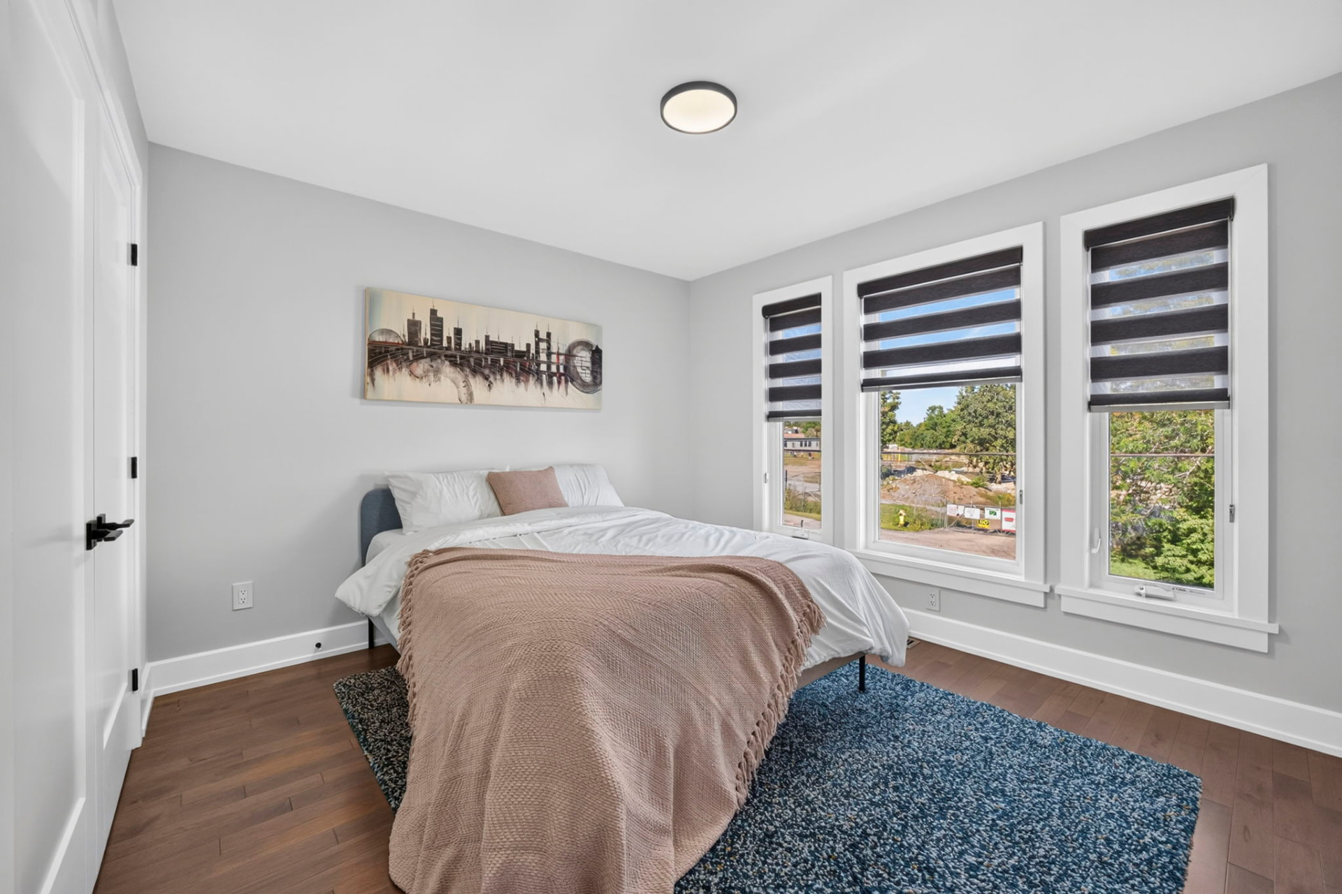 Bedroom with three windows
